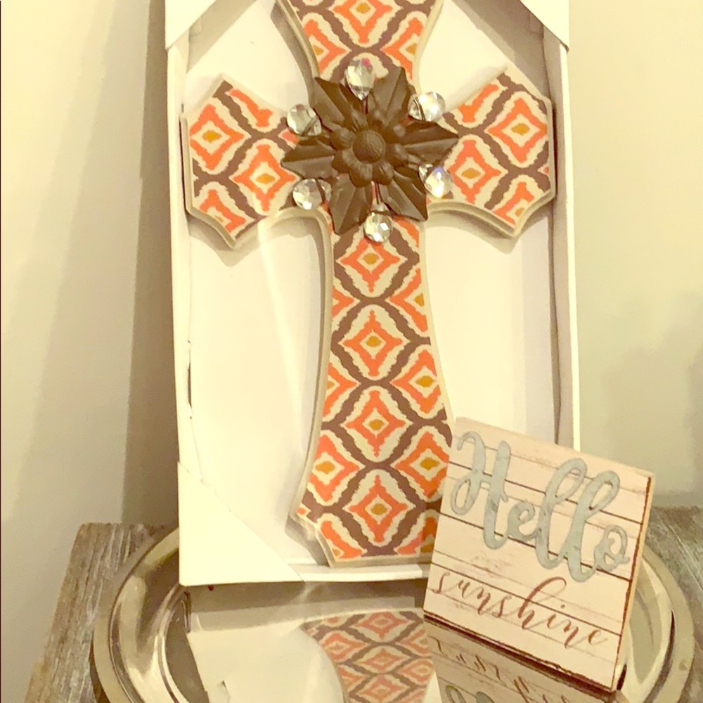 A colorful cross with bling